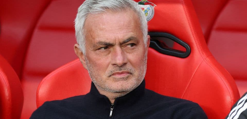 Manager sitting on bench during match