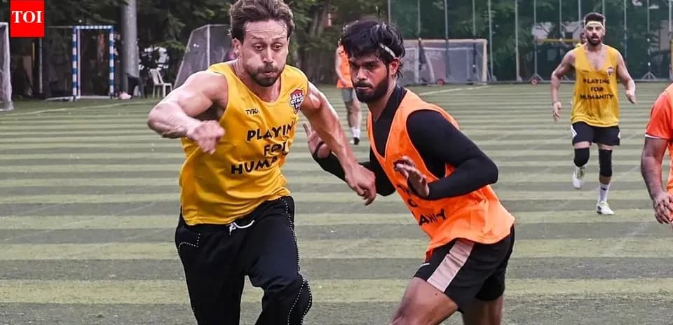 Two players competing during a football training session
