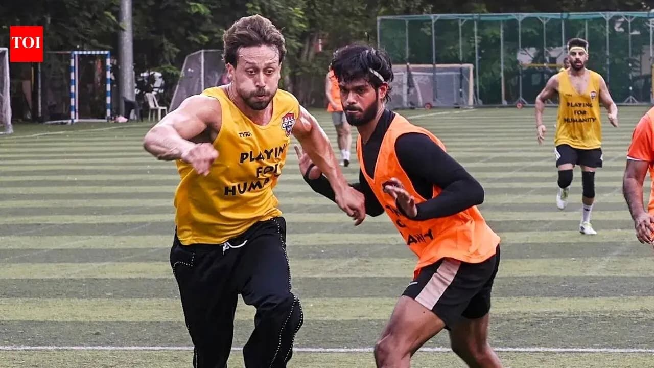 Two players competing during a football training session