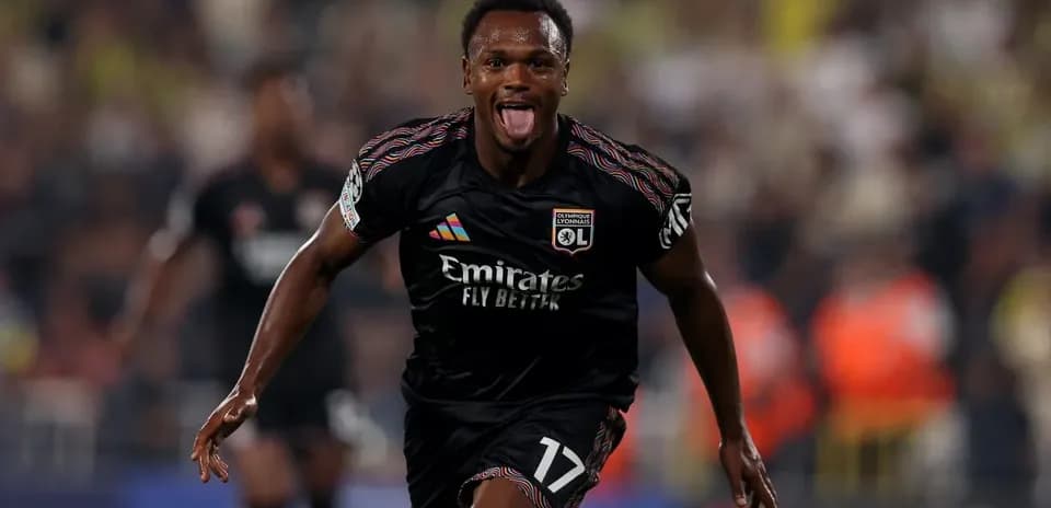 Lyon player celebrating a goal in UEFA Champions League