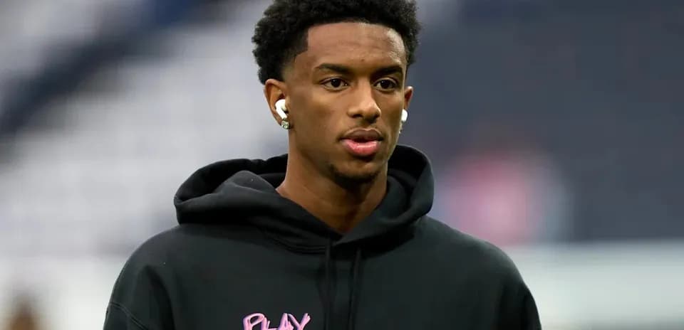 Player wearing headphones during warm-up session