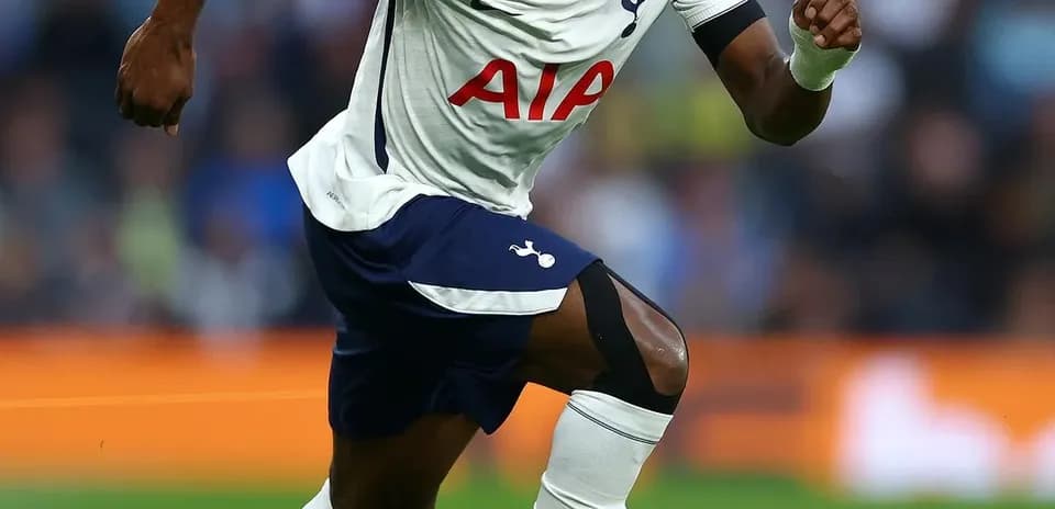 Player sprinting with ball during Tottenham match