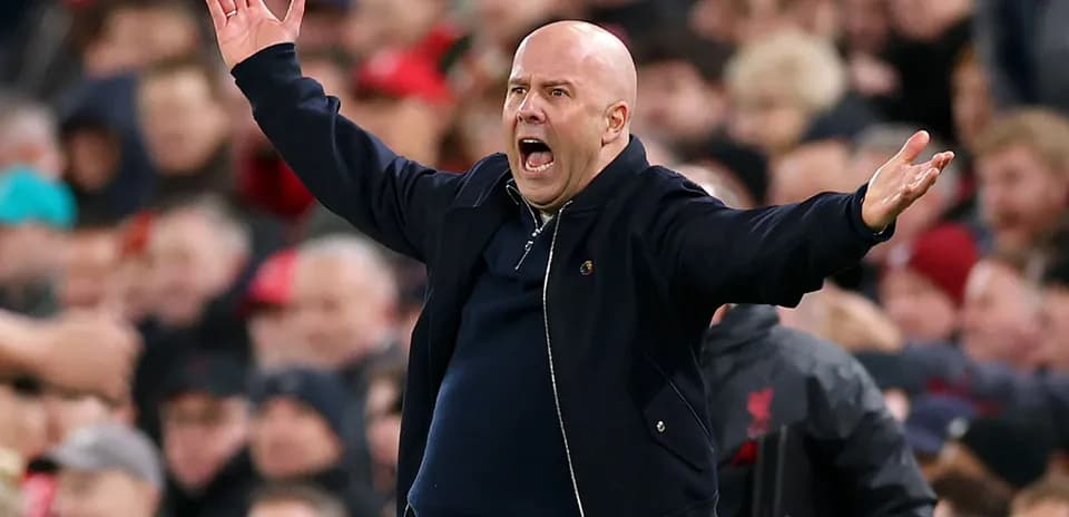 Coach gesturing animatedly during a match