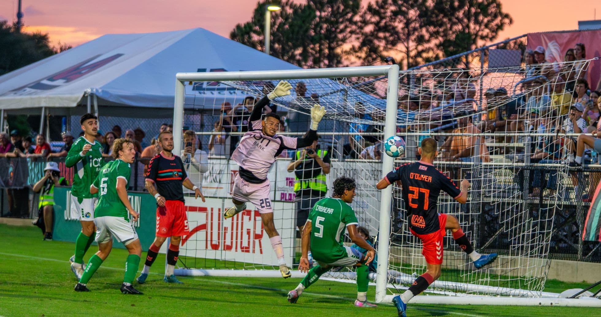 Goalkeeper jumping to save a shot on goal