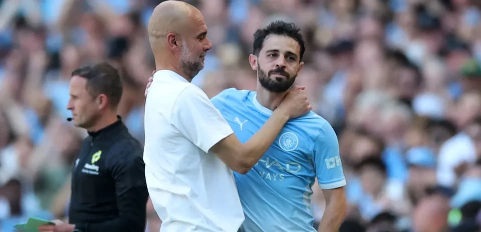 Pep Guardiola embracing Bernardo Silva during match
