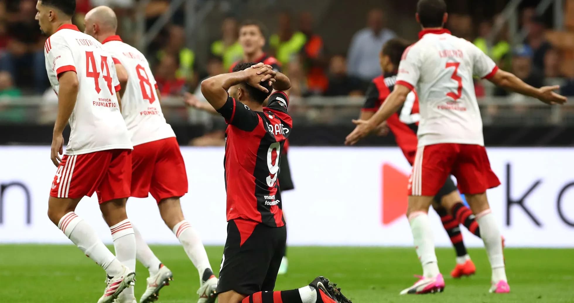 AC Milan player reacting during match against Benfica