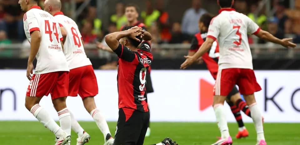 AC Milan player reacting during match against Benfica