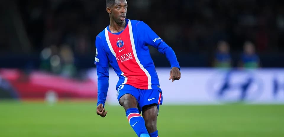 Player in PSG kit dribbling during match