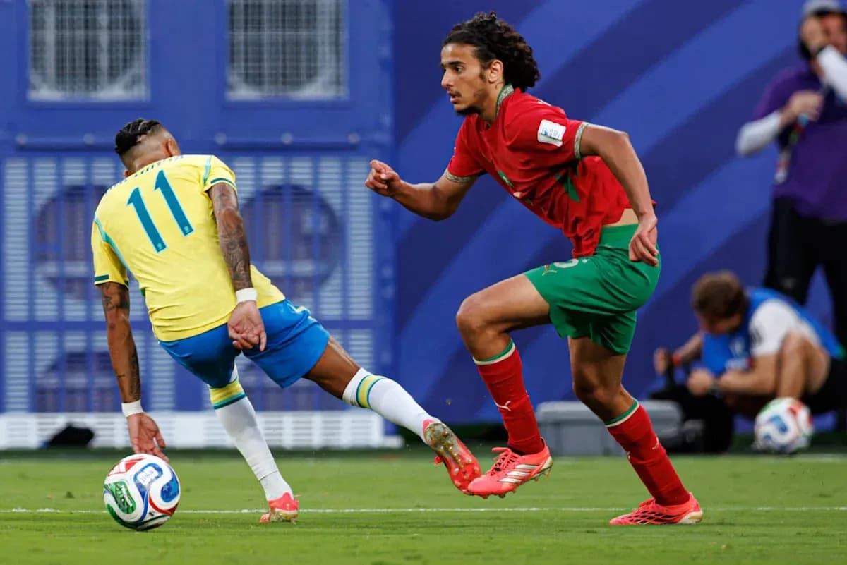 Brazilian player dribbling past Moroccan defender