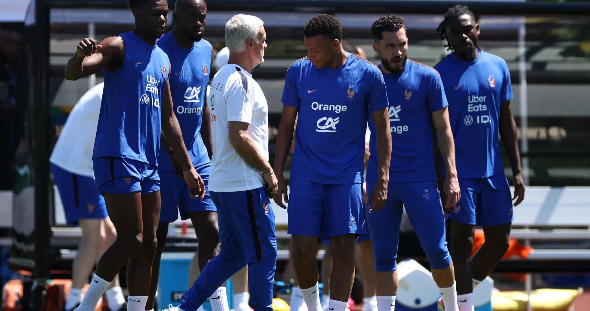 French team players training with coach outdoors