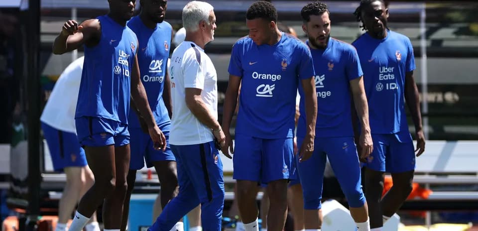 French team players training with coach outdoors