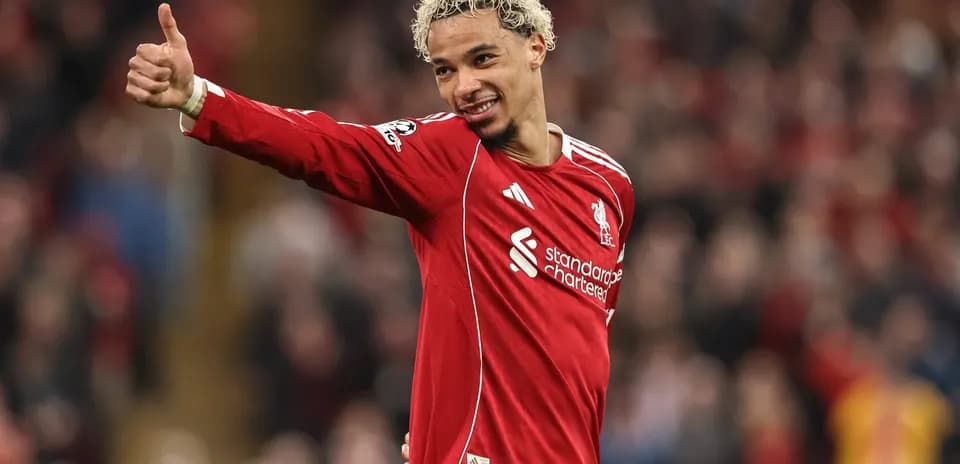 Player giving thumbs up in Liverpool jersey
