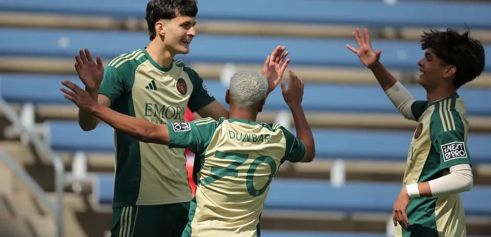Players celebrating a goal during match