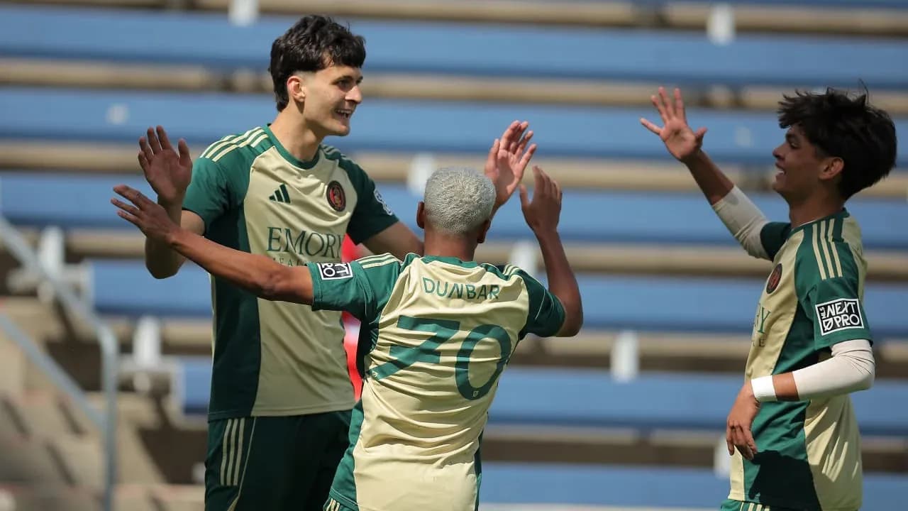 Players celebrating a goal during match