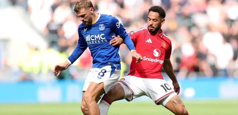 Everton player challenged by Manchester United opponent