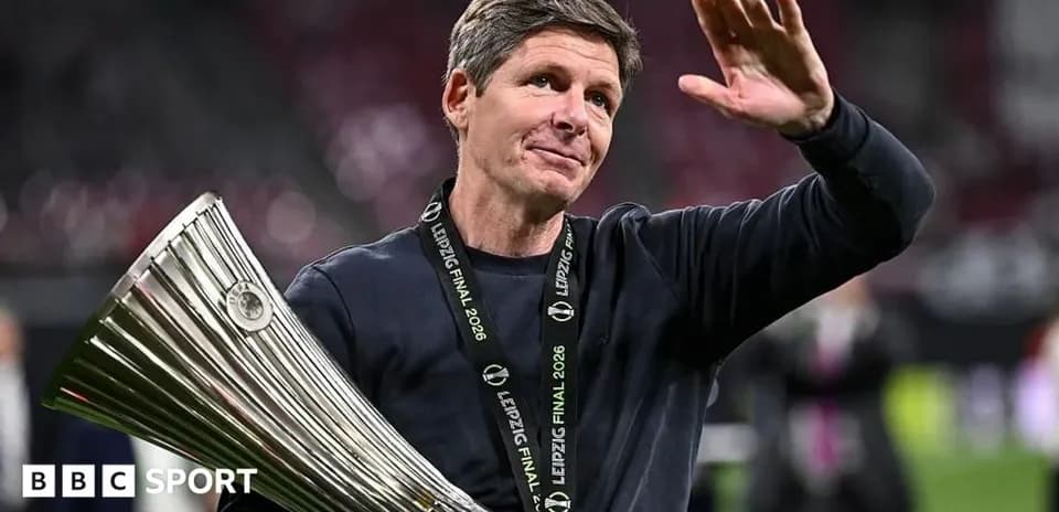 Coach celebrating with trophy at Leipzig Final 2026