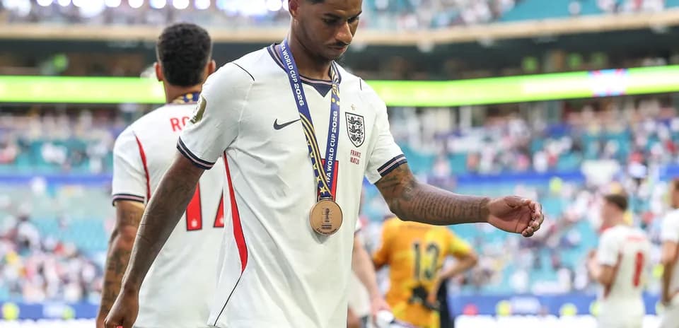 Player with bronze medal walking off the field