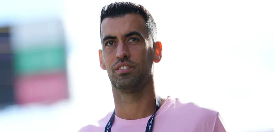 Player in pink shirt standing on the field