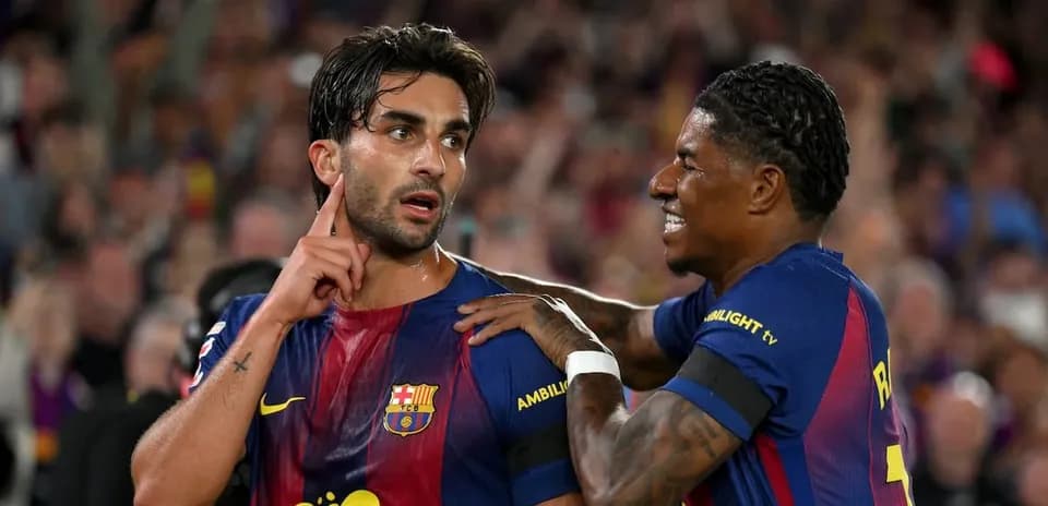 Barcelona players celebrating a goal on the field