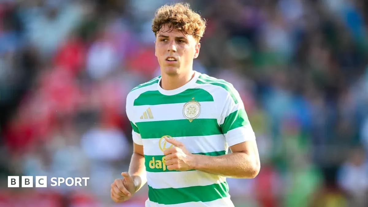 Player in Celtic kit running on the pitch