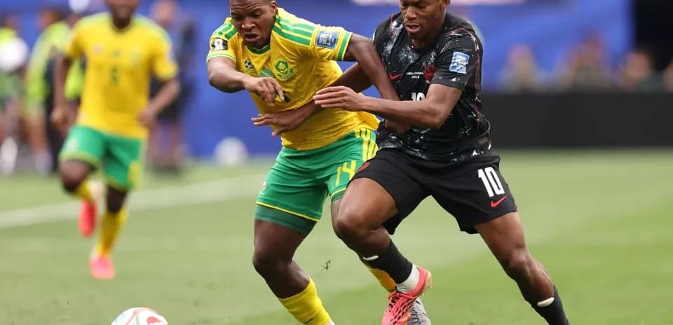 Two players contesting the ball during a match