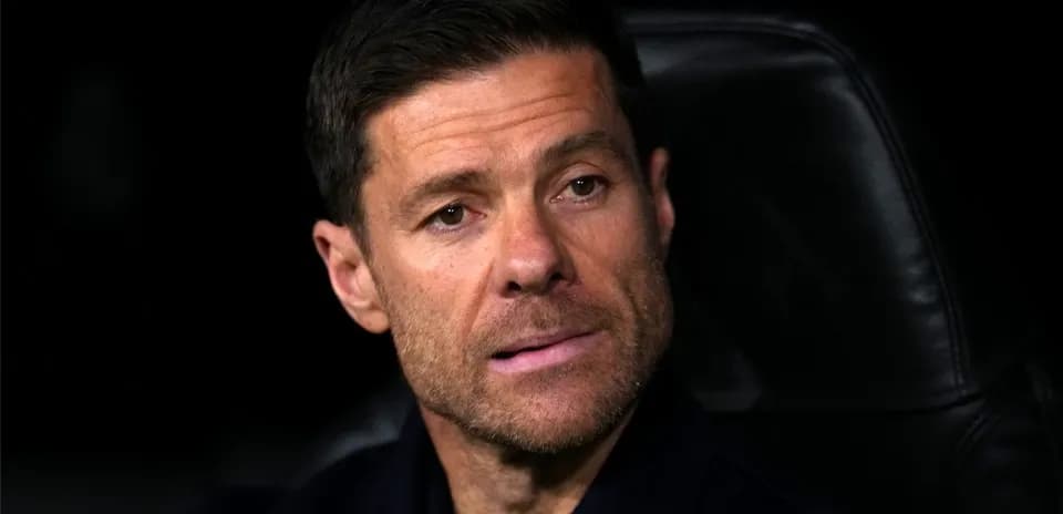 Coach sitting on bench during a match