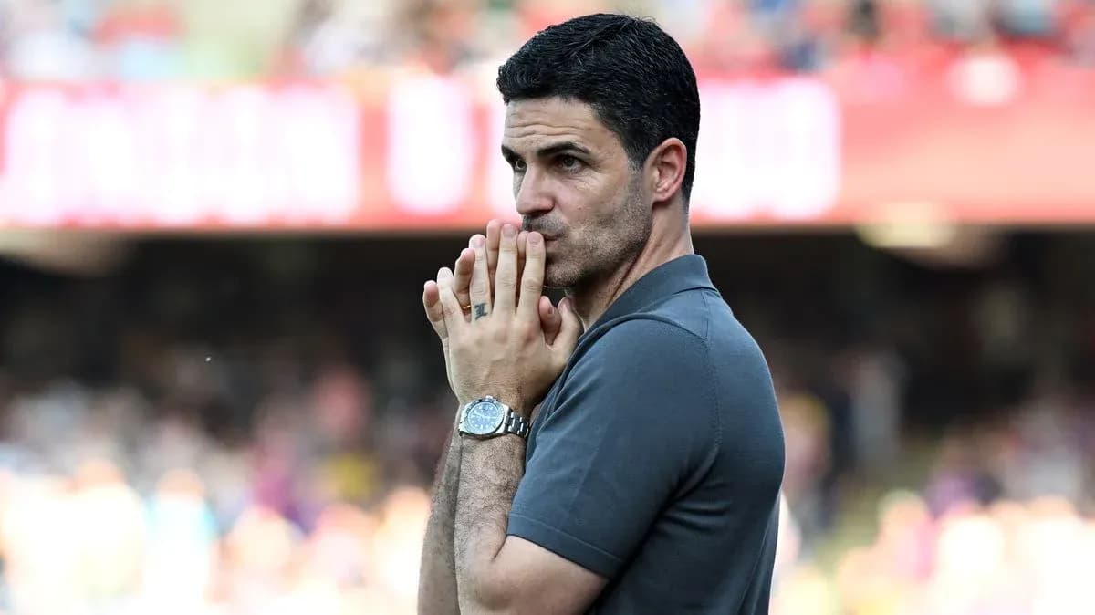 Manager observing the match with hands clasped