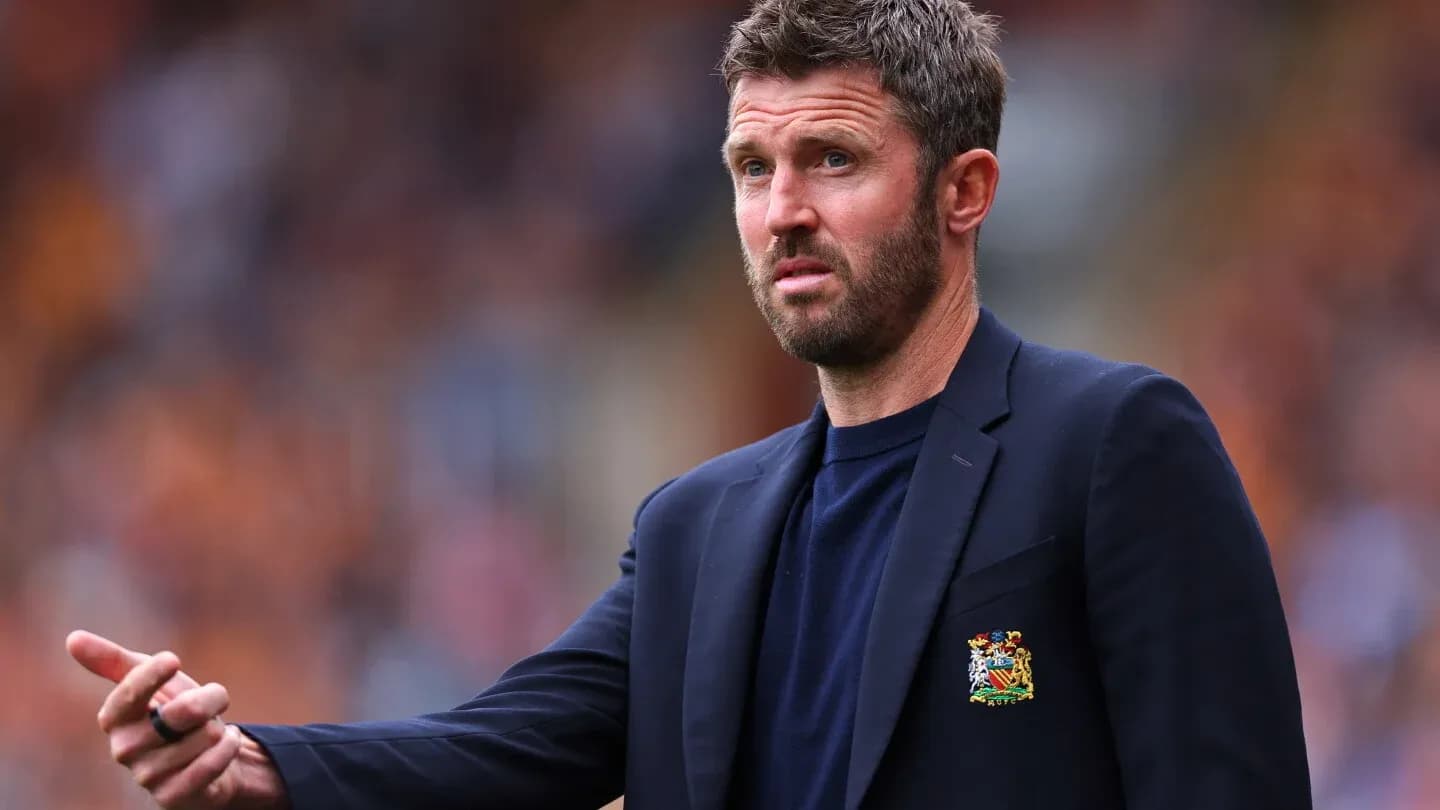 Coach gesturing during a football match