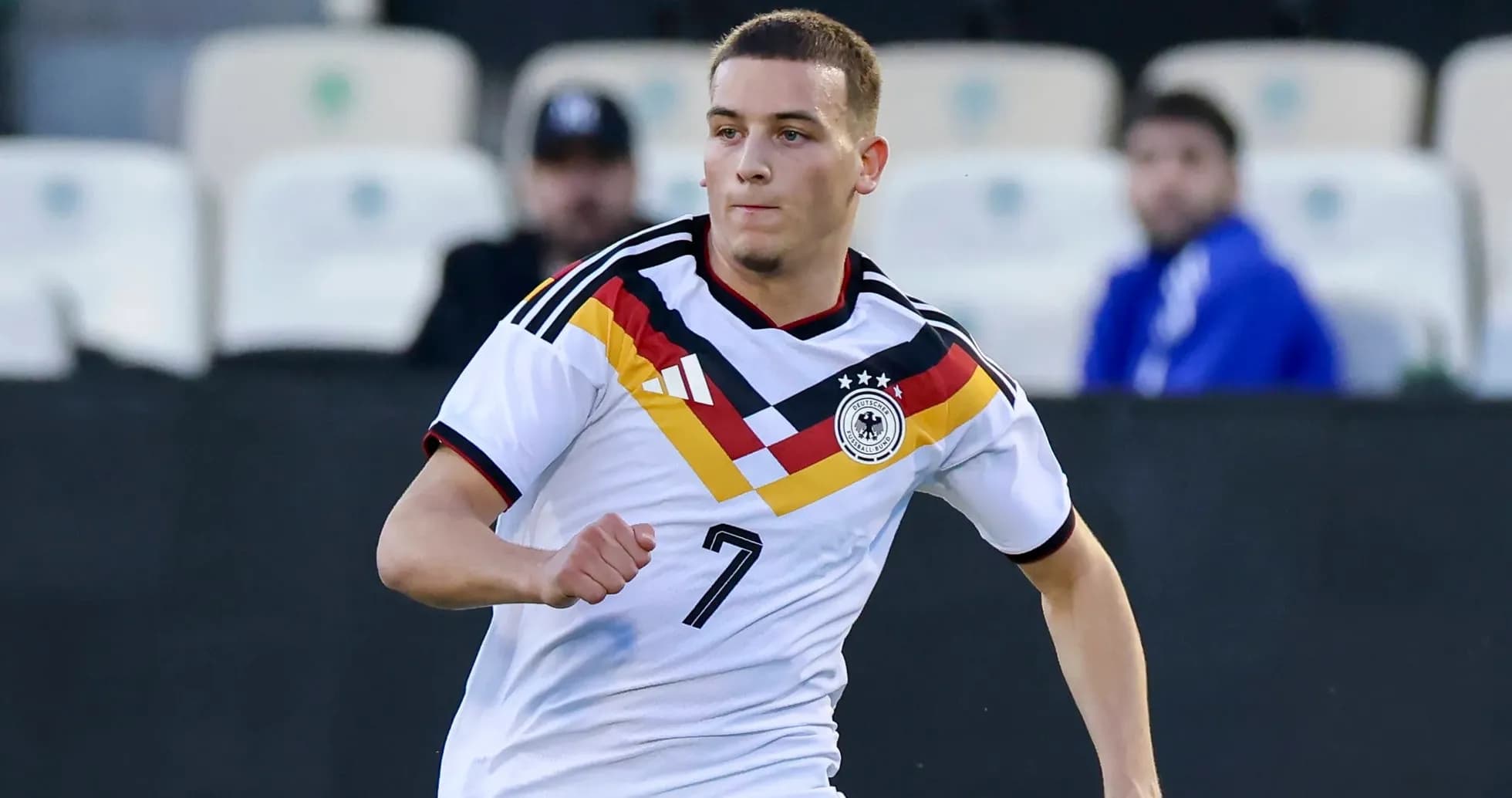 Player in Germany kit running on the field