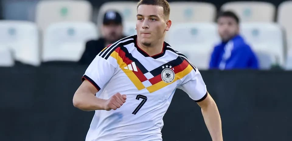 Player in Germany kit running on the field
