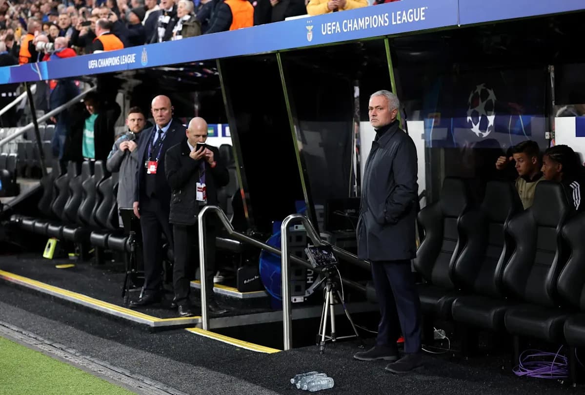 Manager observing from the dugout during UEFA match