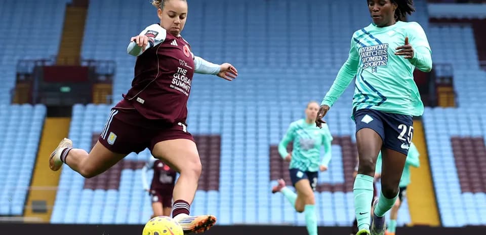 Player kicking ball during London City Lionesses match