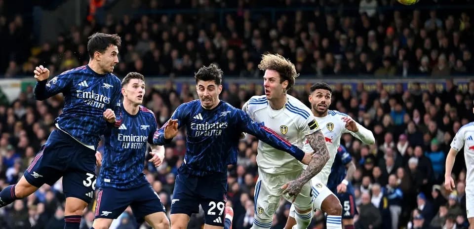 Arsenal players competing against Leeds during match