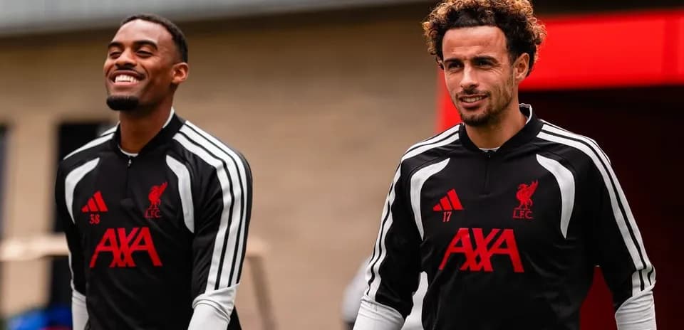 Two Liverpool players arriving at training session