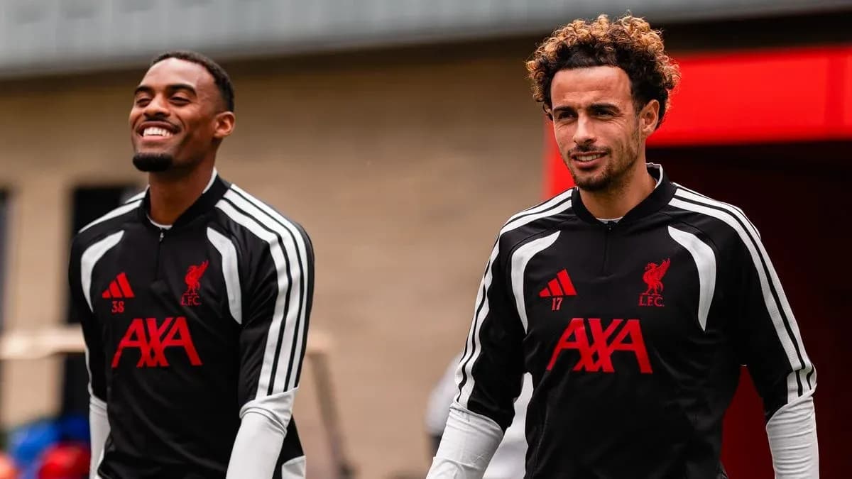 Two Liverpool players arriving at training session