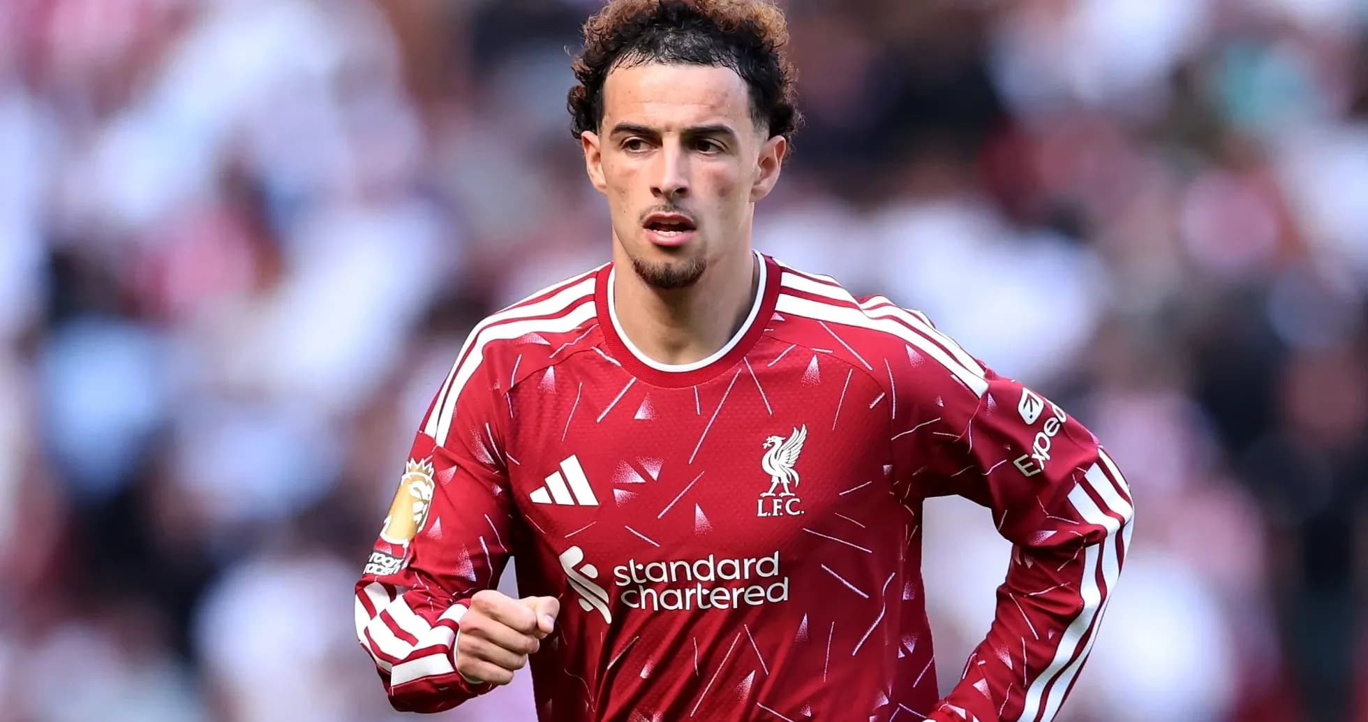 Player in Liverpool kit running on the pitch