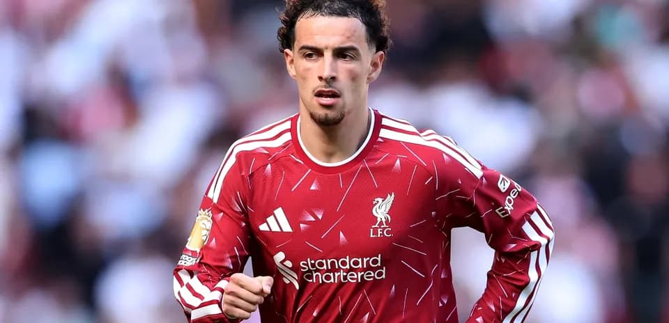 Player in Liverpool kit running on the pitch
