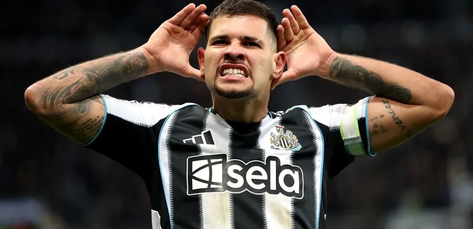 Player celebrating goal with hands to ears