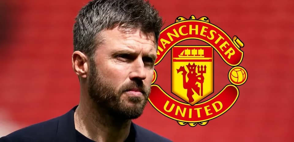 Man standing in front of Manchester United logo