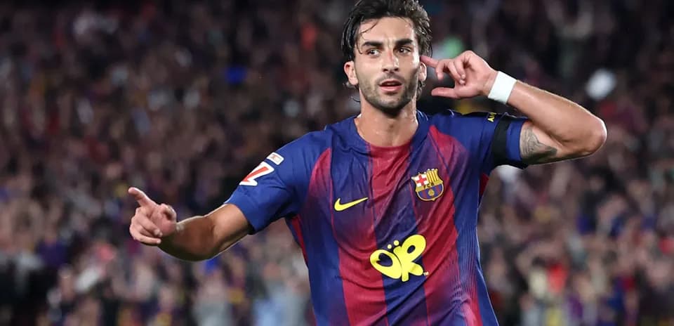 Barcelona player celebrating a goal with fans
