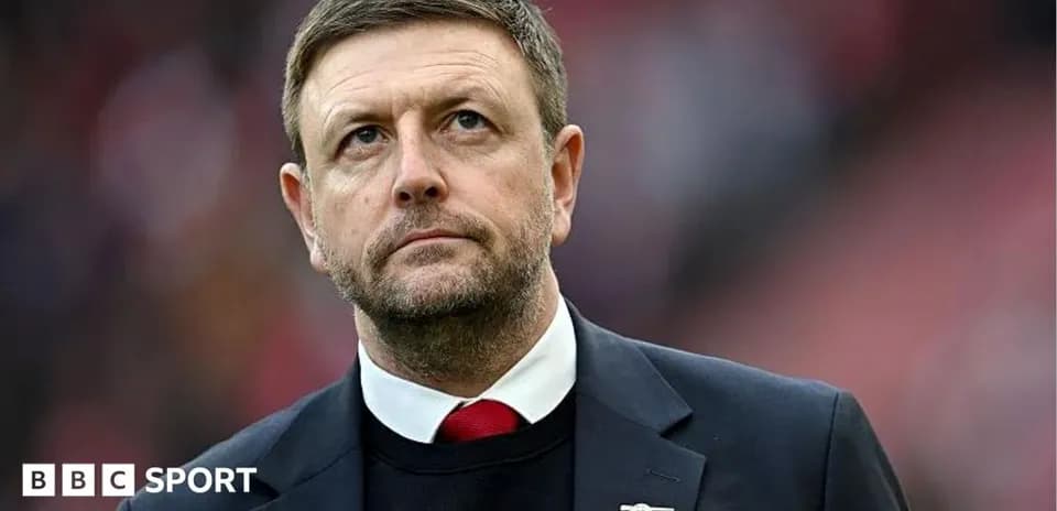 Manager observing the game from the sidelines