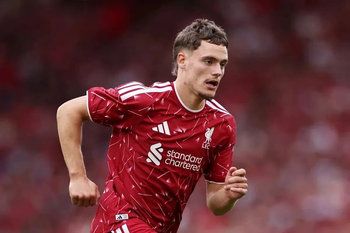 Player running on the field in Liverpool kit