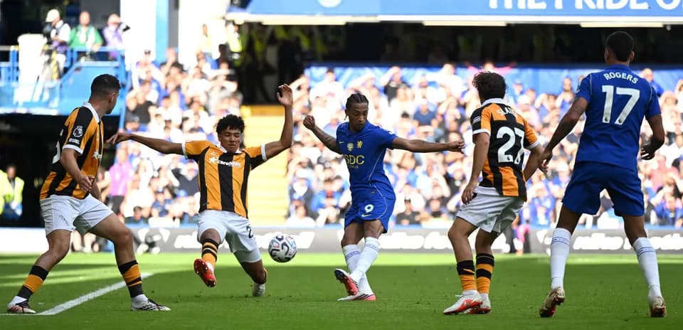 Chelsea player attempting to score against Hull City