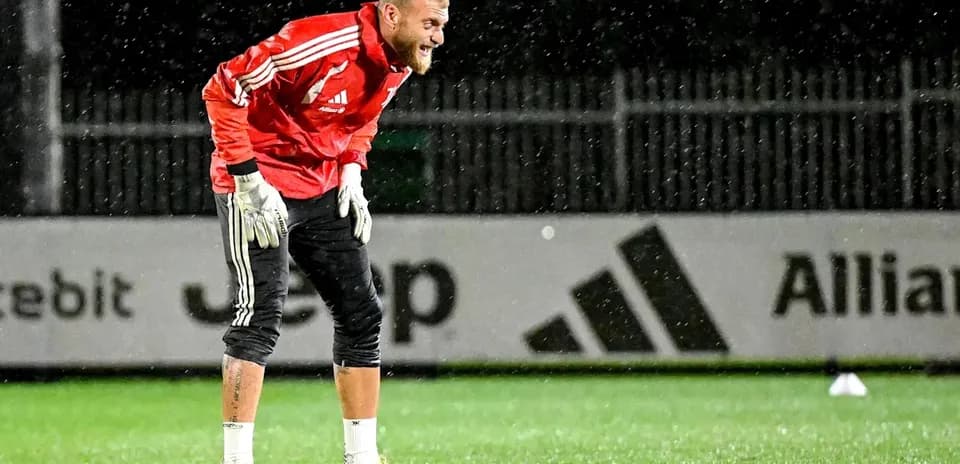 Goalkeeper training in rain at practice session