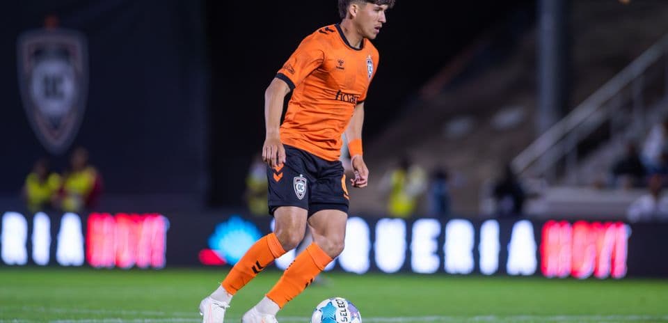 Player from Orange County SC dribbling the ball