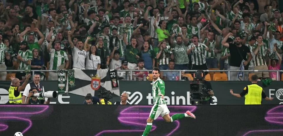 Player celebrating in front of cheering crowd