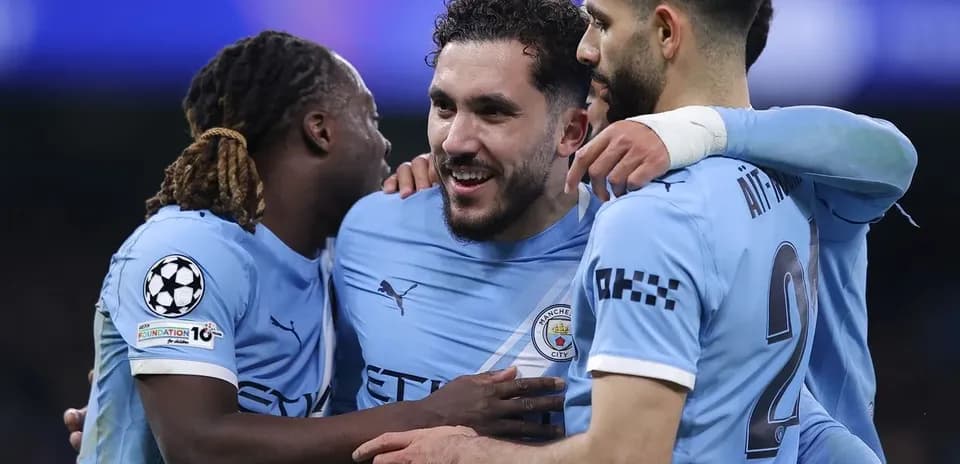 Manchester City players celebrating a goal