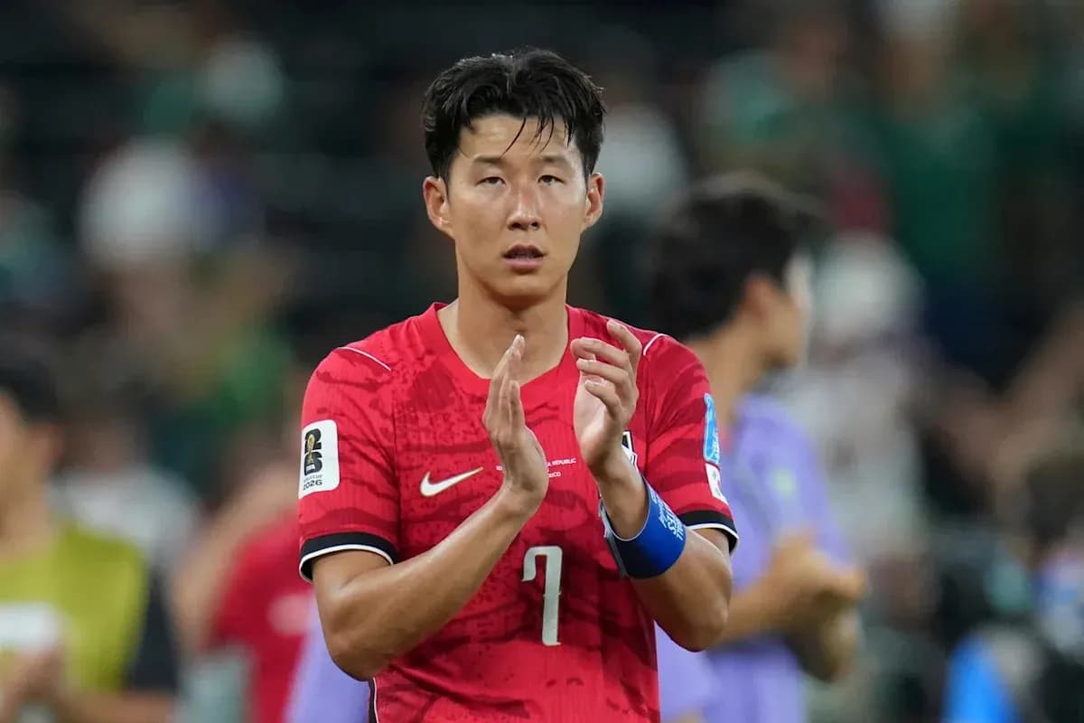 Player applauding after match in red jersey
