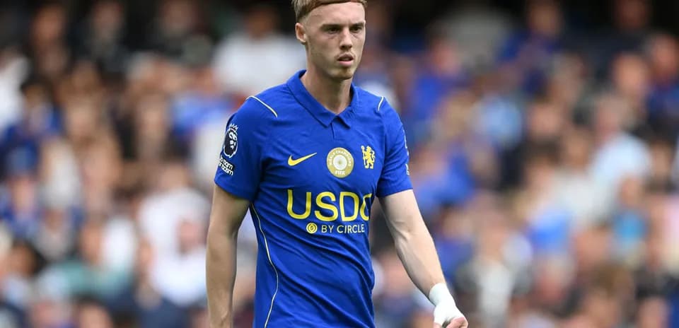 Player wearing blue Chelsea kit during match