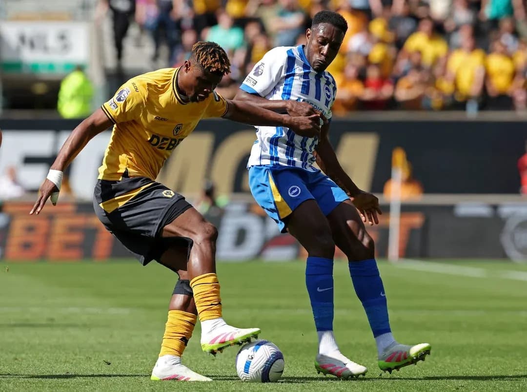 Brighton player tackles Wolves player during match